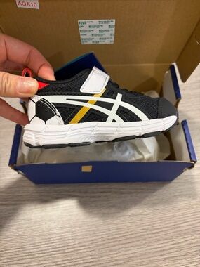 Asics Kids Black White Sneakers with Yellow Accent